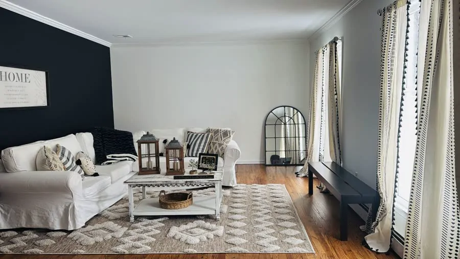 A bright living room with white sofas after a Pura Clean visit